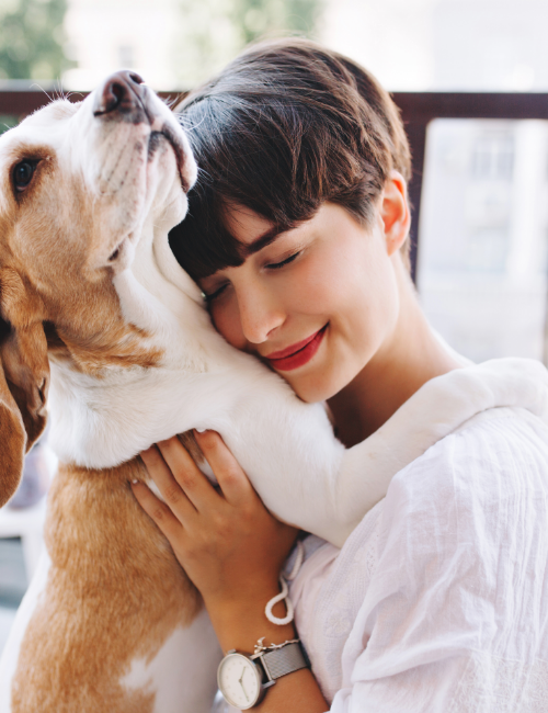 close-up-portrait-pleased-woman-with-short-brown-hair-embracing-funny-beagle-dog-with-eyes-closed